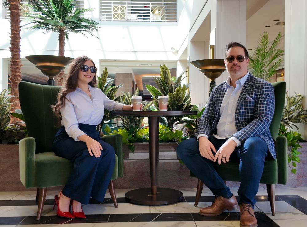 Matt and Destiny Baron at the Clyde hotel in downtown Albuquerque, nm. Having coffee from a local coffee shop talking real estate strategy. Sell Your Home in Albuquerque