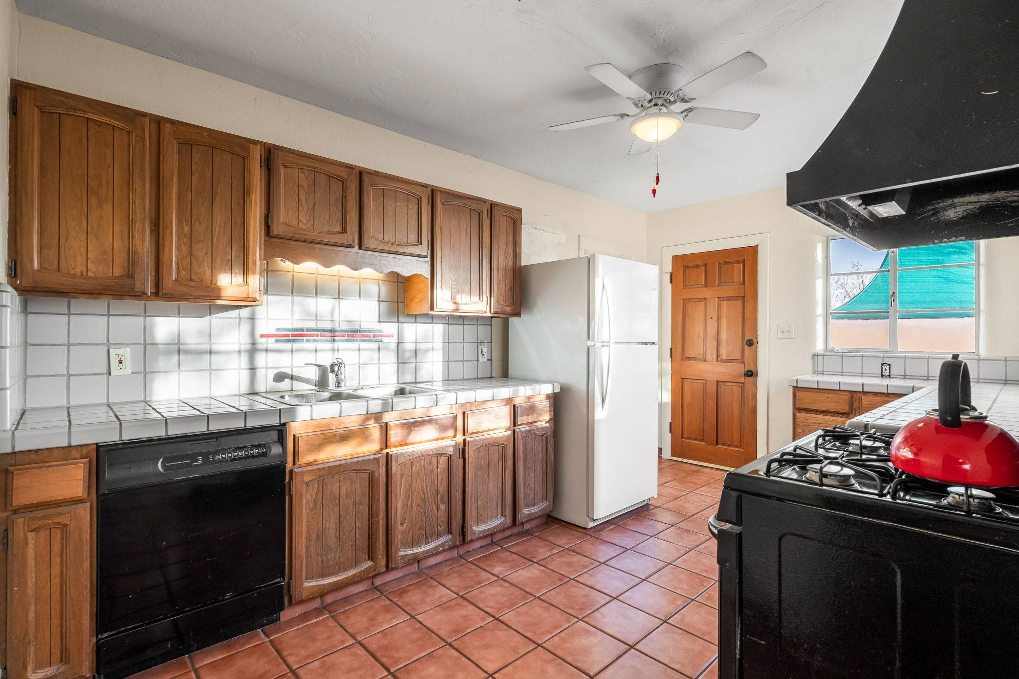 Laguarya kitchen slightly outdated listed by the Better with Baron team. Should You Sell a House As Is vs Renovating in Albuquerque?