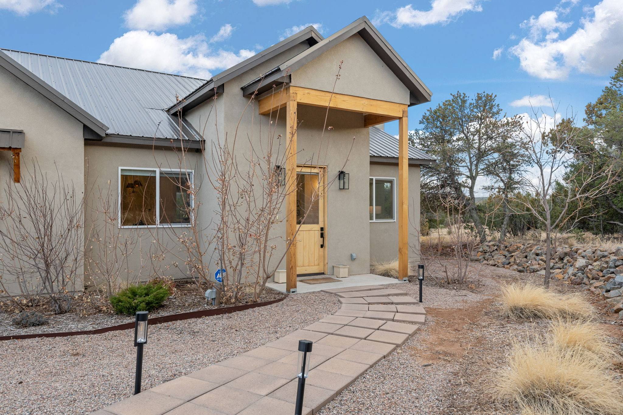 Front entrance from a home listed in Paako, NM by Better with Baron local Albuquerque real estate team. Albuquerque Real Estate Market Trends Buyers Should Know This Spring.