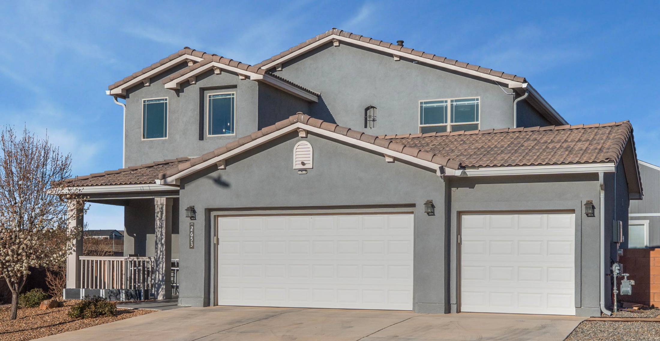 Beautiful two story gray stucco home for sale in Albuquerque, NM. Moving to Albuquerque Pros and Cons (2026 Guide)