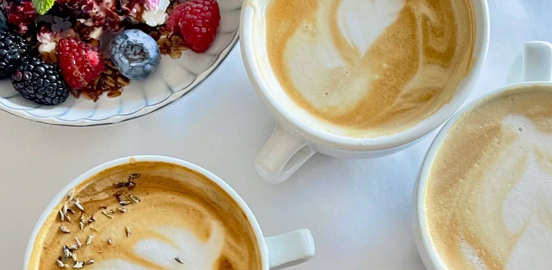Meraki coffee house. Three lattes and a fruit bowl. NE Heights Albuquerque Homes 