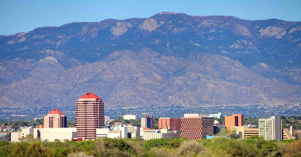 A shot of downtown Albuquerque with the city and Sandia Mountains in the background. Albuquerque Home Prices by Neighborhood in 2026
