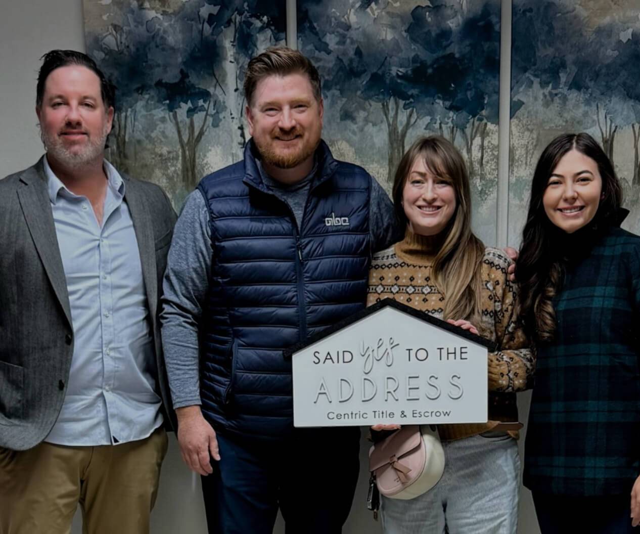 The Better with Baron tea, with happy buyers holding a sign that says, "we said yes to the address!" Down payment for a house in Albuquerque 