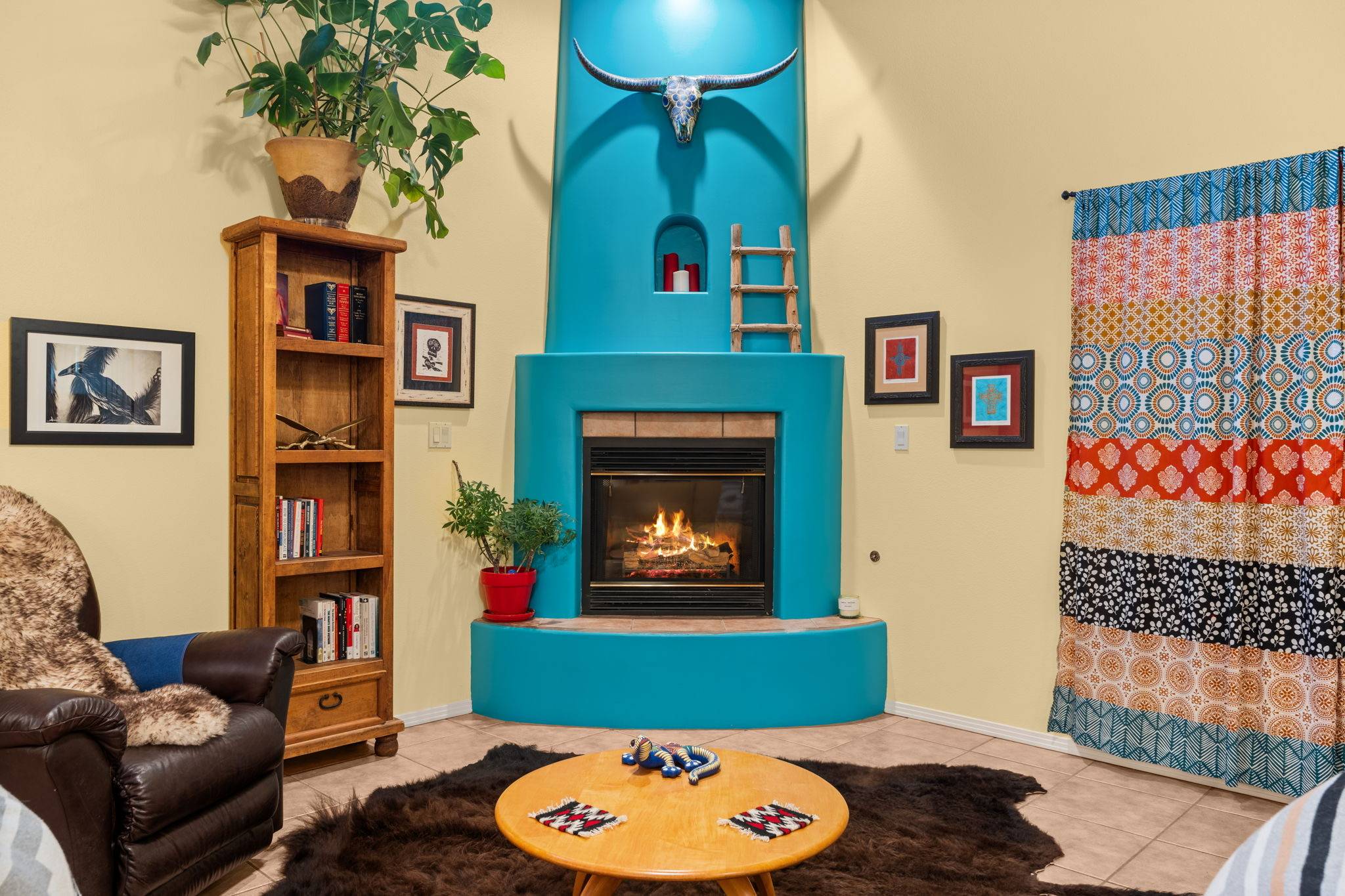 Old Town Albuquerque homes. A turquoise painted kiva style fireplaces in a home for sale in Albuquerque, NM. 