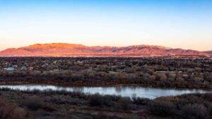 Sandia Mountains and Rio Grande river at dusk. Albuquerque's Westside.
